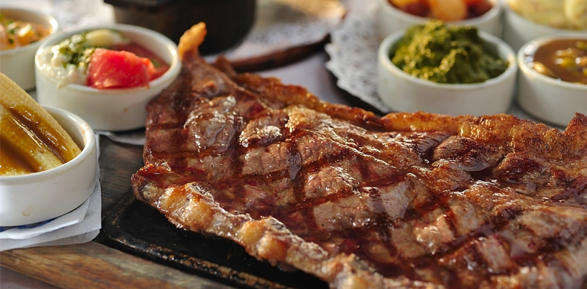 A plated piece of meat, a common part of Argentinian cuisine known as asado
