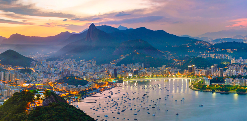 The city of Rio de Janeiro and the iconic Sugarloaf Mountain illuminated at night