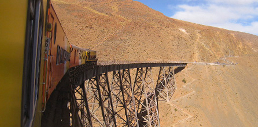 The train to the clouds, one of the highest railroads in the world, crossing a rail bridge