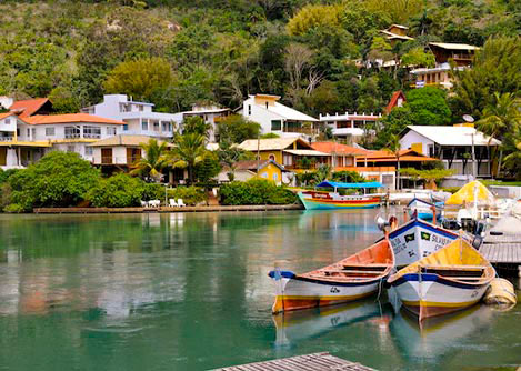 Boats in the water next to the small fishing village of Barra da Lagoa in Florianopolis.
