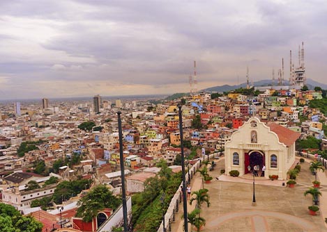 A view of the Guayaquil skyline and the colorful Las Peñas neighborhood from a lookout point.
