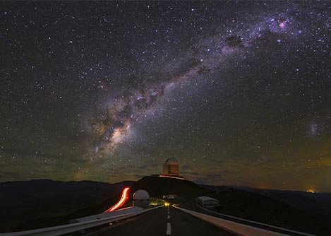 The milky way in the night sky above an astronomical observatory in the Elqui Valley.