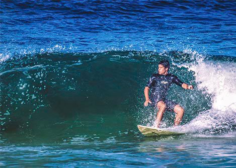 A surfer catching a wave in Paraty, a great place for surfing and other water sports.