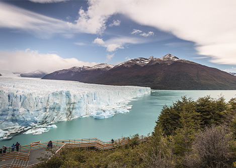 Visitors on a walkway across the water from an enormous glacier near the town of El Calafate.