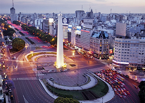 Sunset over the famous Obelisco with the city of Buenos Aires stretching into the distance.